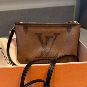 LOUIS VUITTON
Reverse Monogram Giant Double Zip Pochette - Crossbody Handbag